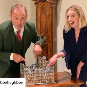 Hugh Bonneville and Laura Carmichael pointing at the Wrebbit 3D Downton Abbey 3D Puzzle at a press junket in Hamburg, Germany.